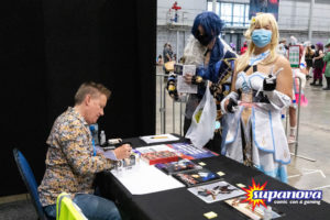 Spike Spencer signing autographs for fans in cosplay at Supanova 2021 - Brisbane.
